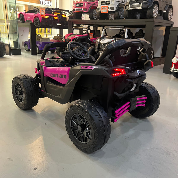 A 24V Licensed Can am ride on toy car Touch TV UTV 4 x 4 Rubber Tires Leather Seat Hot Pink
