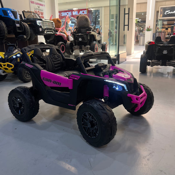 A 24V Licensed Can am ride on toy car Touch TV UTV 4 x 4 Rubber Tires Leather Seat Hot Pink