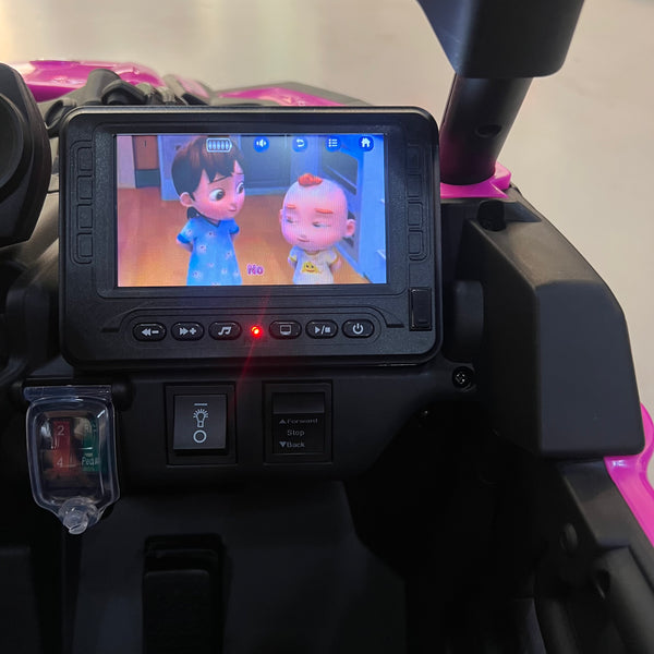 A 24V Licensed Can am ride on toy car Touch TV UTV 4 x 4 Rubber Tires Leather Seat Hot Pink