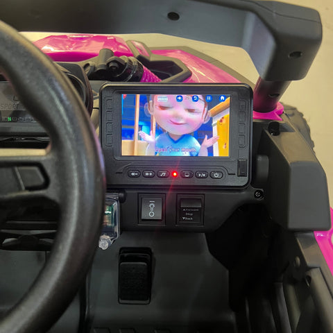 A 24V Licensed Can am ride on toy car Touch TV UTV 4 x 4 Rubber Tires Leather Seat Hot Pink