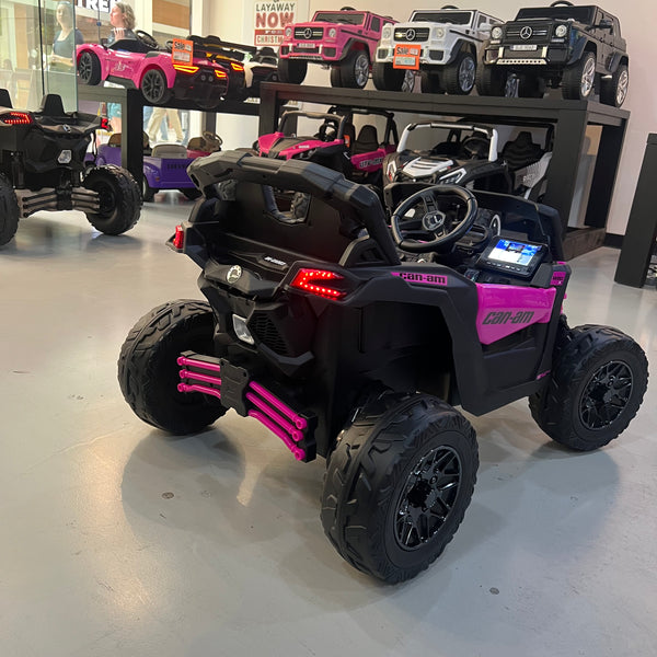 A 24V Licensed Can am ride on toy car Touch TV UTV 4 x 4 Rubber Tires Leather Seat Hot Pink