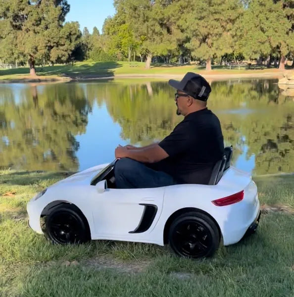 XXL PORSCHE STYLE 24 V 14 AH LUXURY ELECTRIC GO CART WITH REAL AIR- FILLED TIRES CENTER DIFFERENTIAL AND DISC BRAKES WITH TOUCH TV, BLUETOOTH LEATHER SEATS AGES 6 – 14 FRONT AND BRAKE LIGHTS