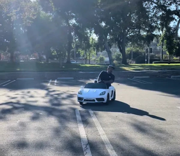 XXL PORSCHE STYLE 24 V 14 AH LUXURY ELECTRIC GO CART WITH REAL AIR- FILLED TIRES CENTER DIFFERENTIAL AND DISC BRAKES WITH TOUCH TV, BLUETOOTH LEATHER SEATS AGES 6 – 14 FRONT AND BRAKE LIGHTS