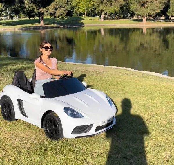 XXL PORSCHE STYLE 24 V 14 AH LUXURY ELECTRIC GO CART WITH REAL AIR- FILLED TIRES CENTER DIFFERENTIAL AND DISC BRAKES WITH TOUCH TV, BLUETOOTH LEATHER SEATS AGES 6 – 14 FRONT AND BRAKE LIGHTS