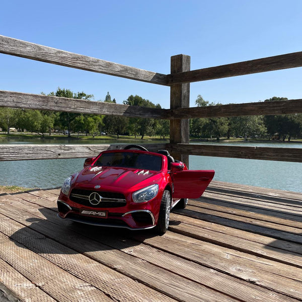 TOUCH TV LICENSED METALLIC MERCEDES AMG UPGRADED 12V 7AH WITH TOUCH TV, PARENTAL REMOTE, RUBBER TIRES AND LEATHER SEAT AGES 1-4 SPRAY PAINTED RED ETA December 17th